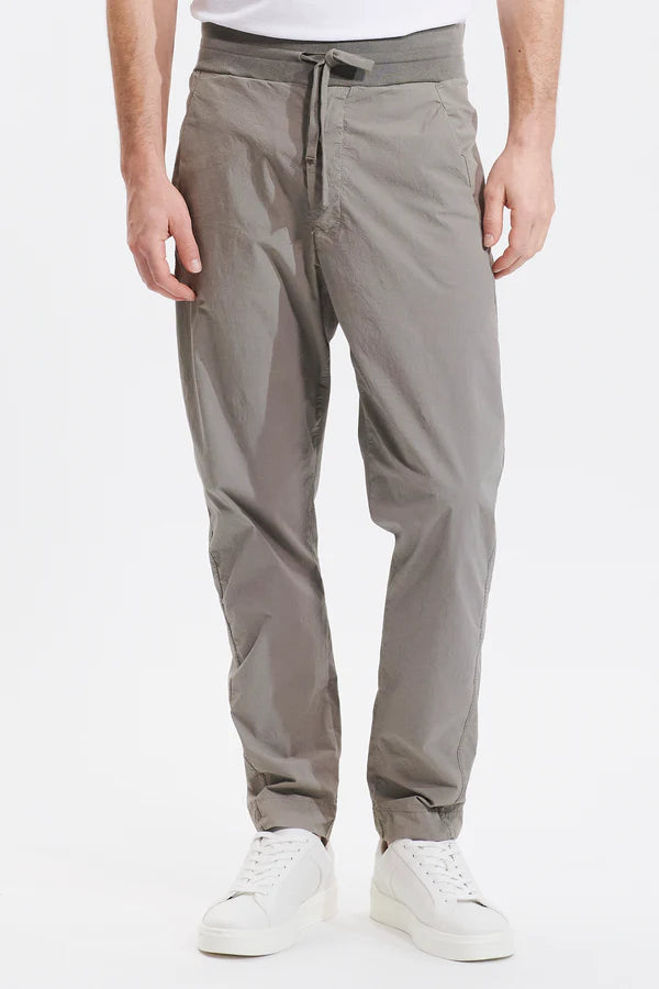 Loose-fitting jogging trousers in stretch crepe cotton with knitted waistband and drawstring Clay