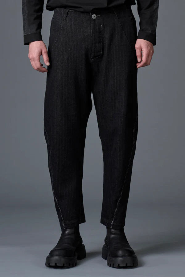 Ergonomic trousers in herringbone cotton and wool with contrasting thick yarn stitching