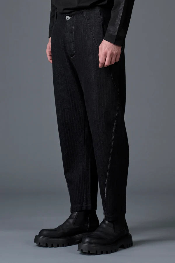 Ergonomic trousers in herringbone cotton and wool with contrasting thick yarn stitching