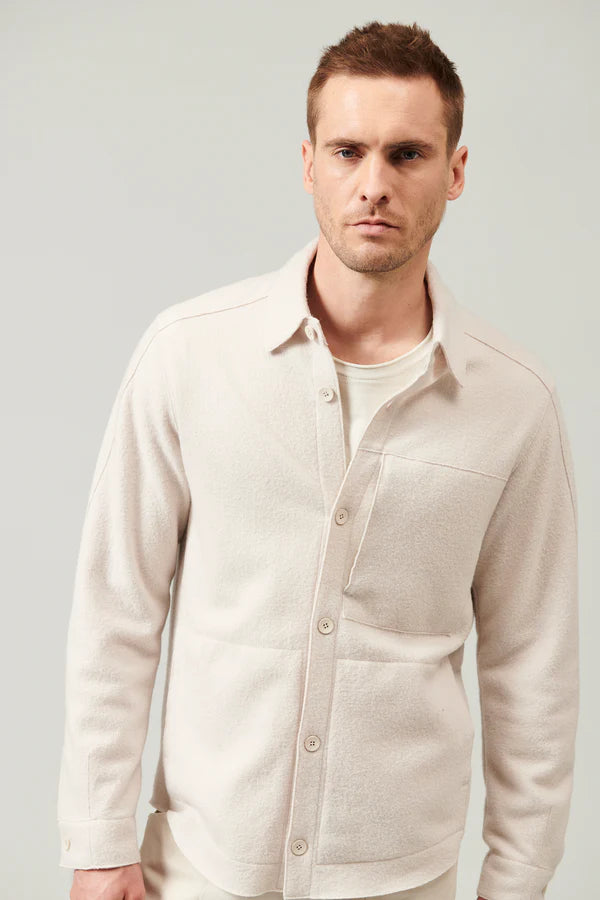 Raw cut boiled wool regular overshirt. buttoned opening, zipped chest pocket