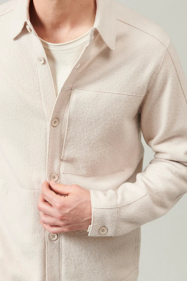 Raw cut boiled wool regular overshirt. buttoned opening, zipped chest pocket