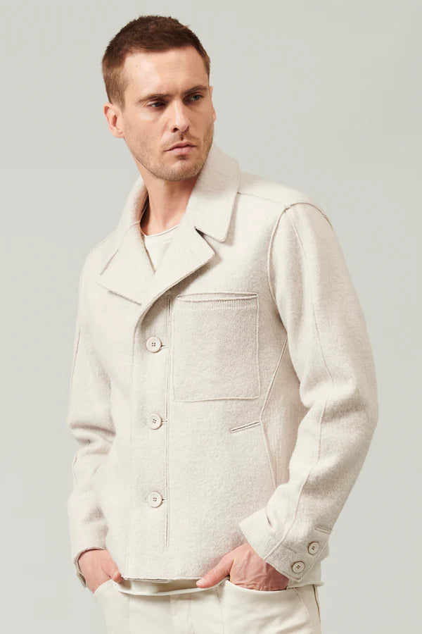 Raw cut boiled wool peacoat. knitted chest pocket