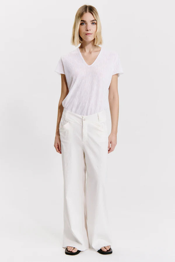 Wide-leg trousers with frayed bottom in viscose and stretch linen milk