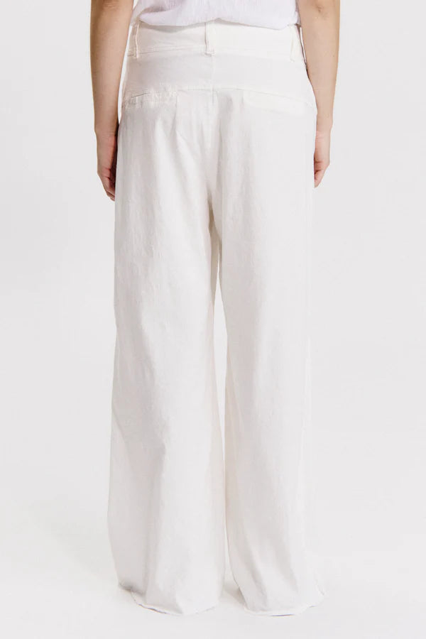 Wide-leg trousers with frayed bottom in viscose and stretch linen milk