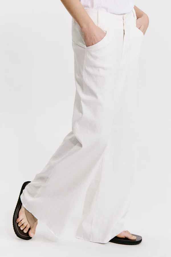 Wide-leg trousers with frayed bottom in viscose and stretch linen milk