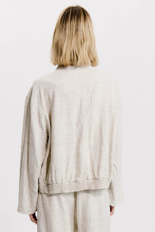 Flared over jacket with gathering motif on the bottom in linen and viscose stretch melange