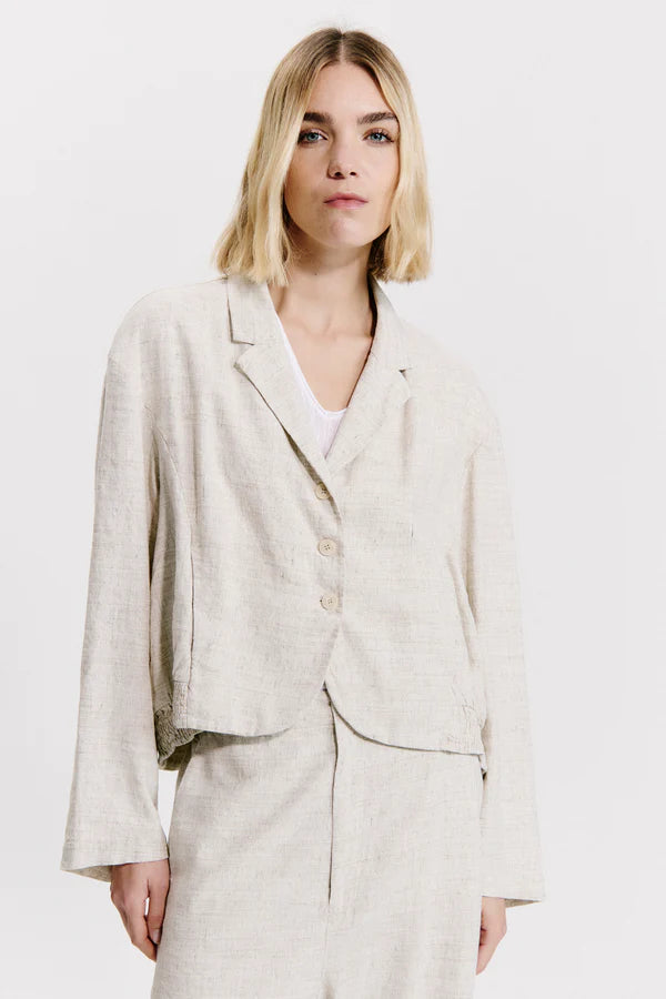 Flared over jacket with gathering motif on the bottom in linen and viscose stretch melange