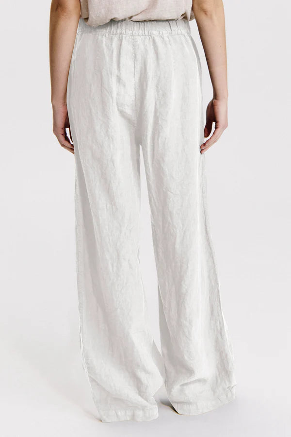 Linen palazzo trousers with elastic at the back. button and zip opening white