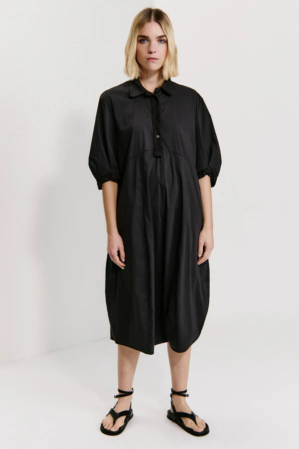 Bombe'-shaped calf-length dress with buttoned polo shirt opening and wide elbow-length sleeves in st