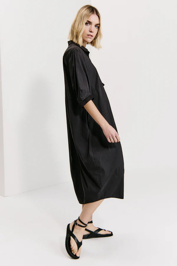 Bombe'-shaped calf-length dress with buttoned polo shirt opening and wide elbow-length sleeves in st